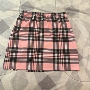 pink white and black mini skirt